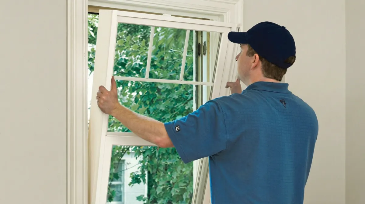 Professional contractors performing a residential window insulation and replacement service in Milwaukee, WI